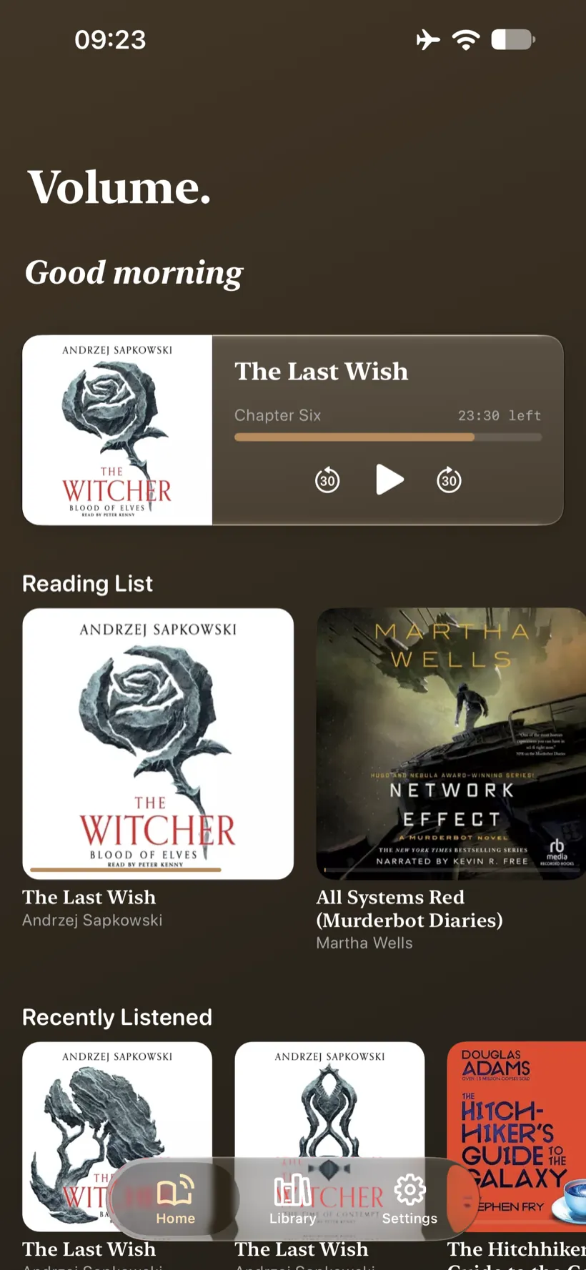 Volume on iPhone &ndash; home screen greeting you by time of day, with a continue-listening card