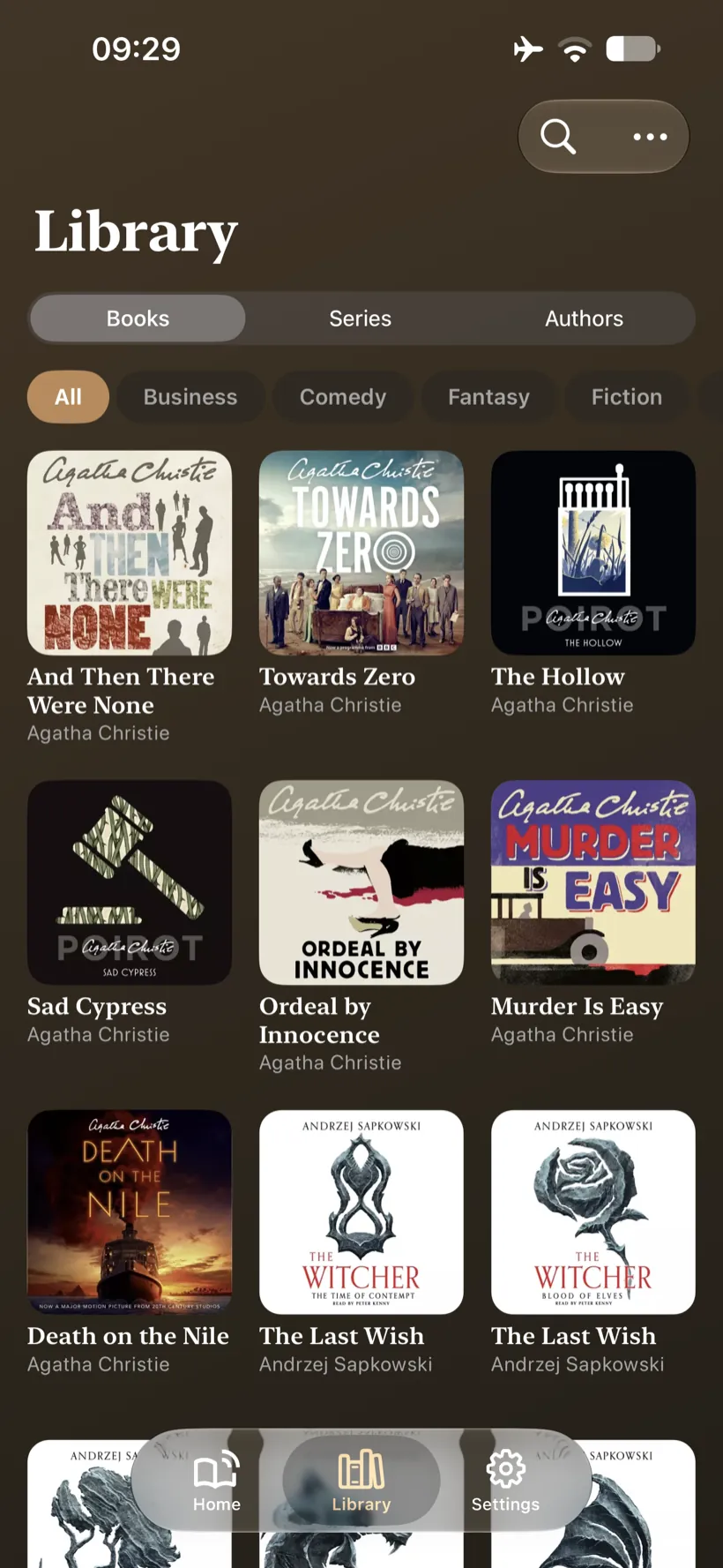 Volume on iPhone &ndash; library grid of audiobook cover art with genre filters